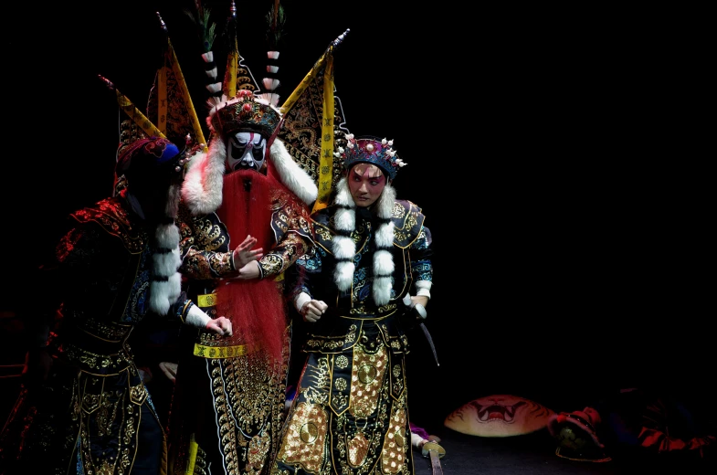 people dressed in colorful costumes on stage