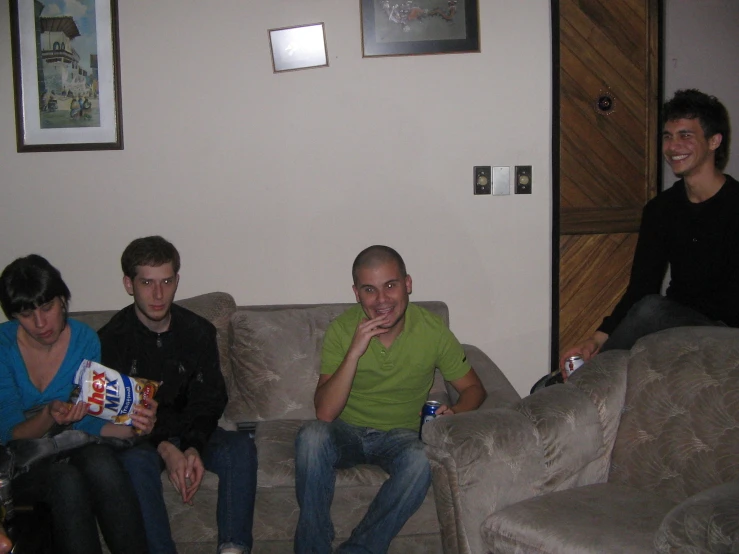 a group of friends sitting on couches around each other