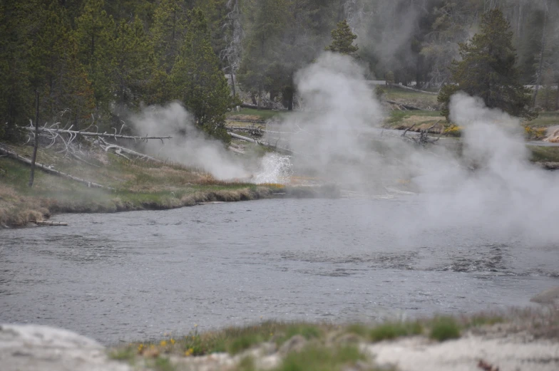 there is a very large body of water with steam rising from it