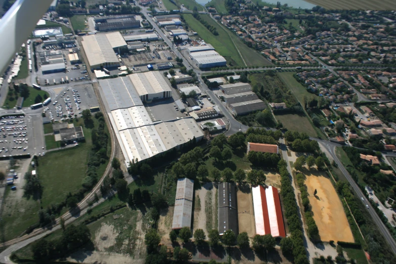 aerial view of factory complex from above near the city
