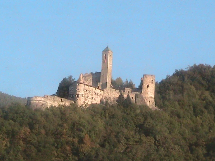 there is a castle that is perched on top of a hill