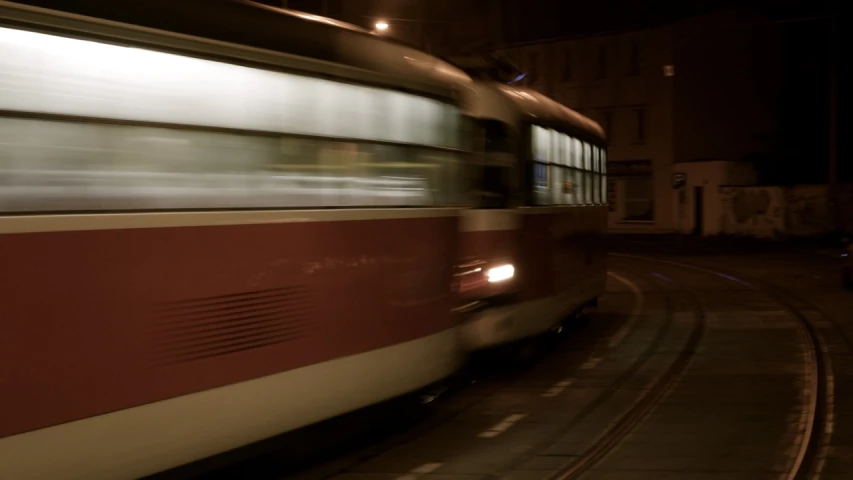 the side of a train moving by at night