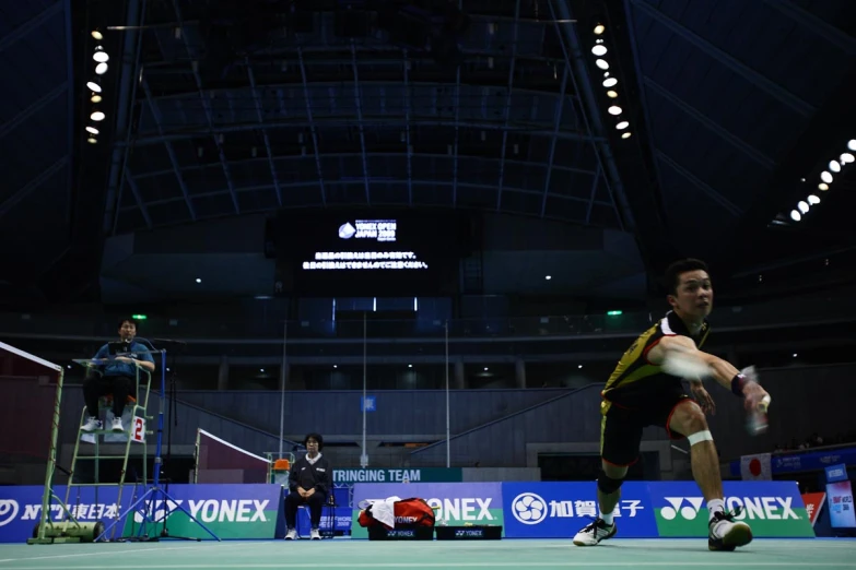 two men play tennis on the tennis court