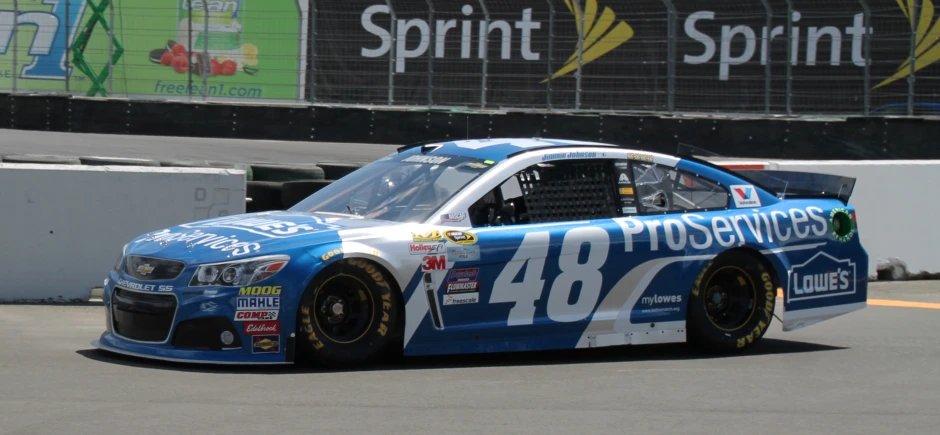 a very nice looking car driving around the track