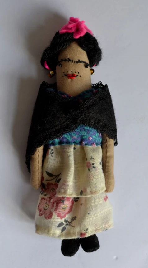 this doll is made out of cloth and has an afro