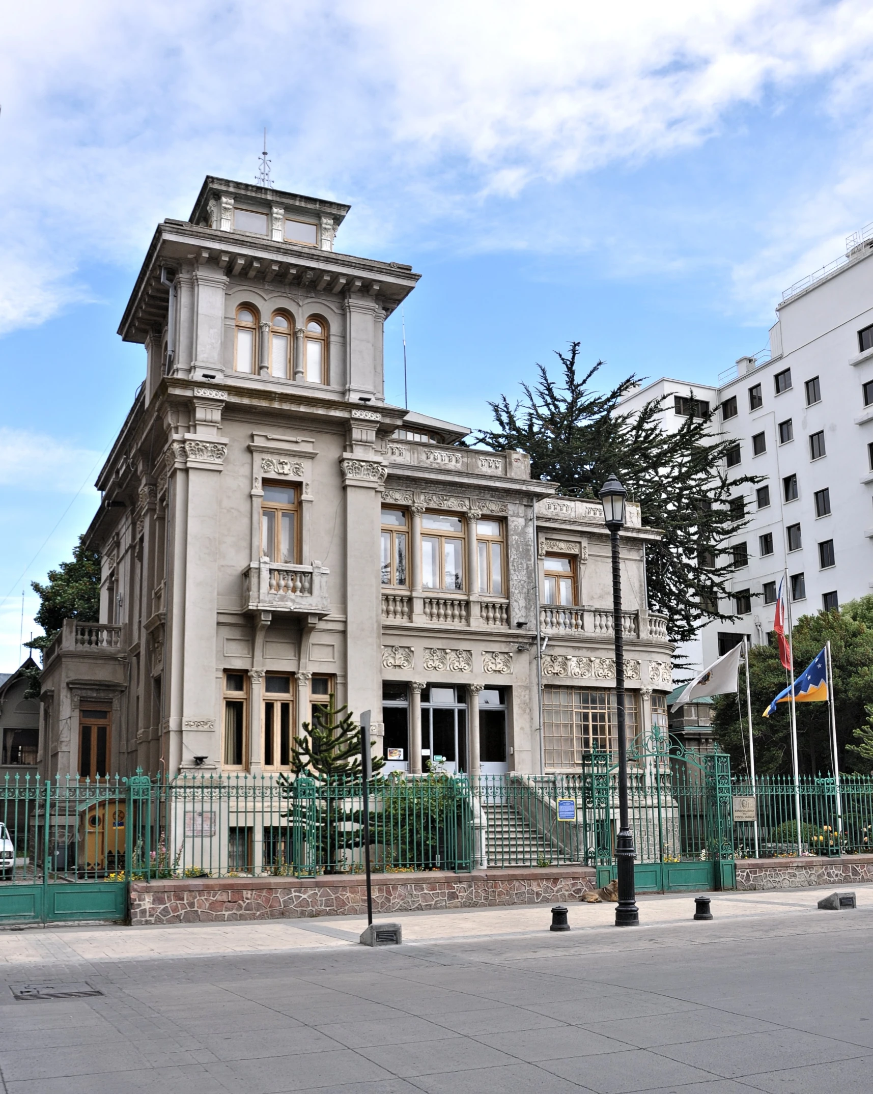 large beige building with lots of windows in front