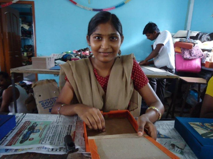 a  sitting at her crafting class