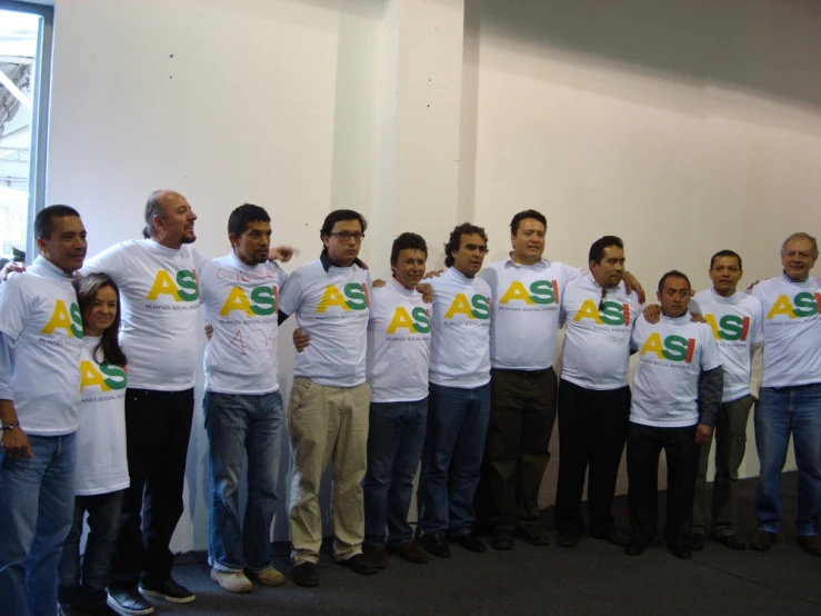a group of people wearing white shirts with assac written on them