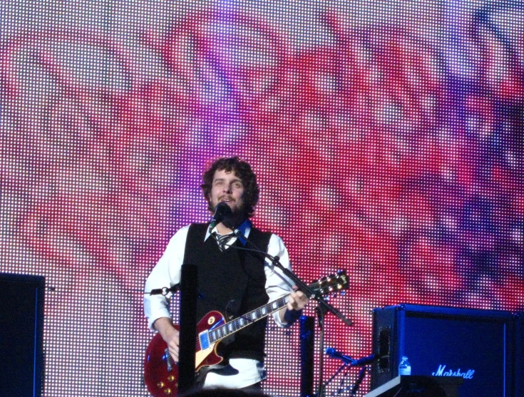 a musician plays on his instrument while performing