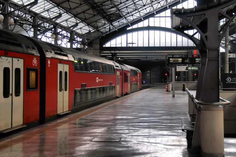 a train is in an empty station with windows