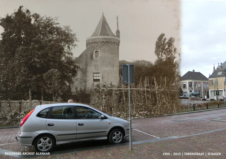 a silver car parked in front of a building