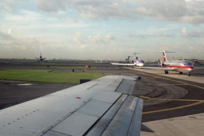 an airport with several airplanes lined up on the runway