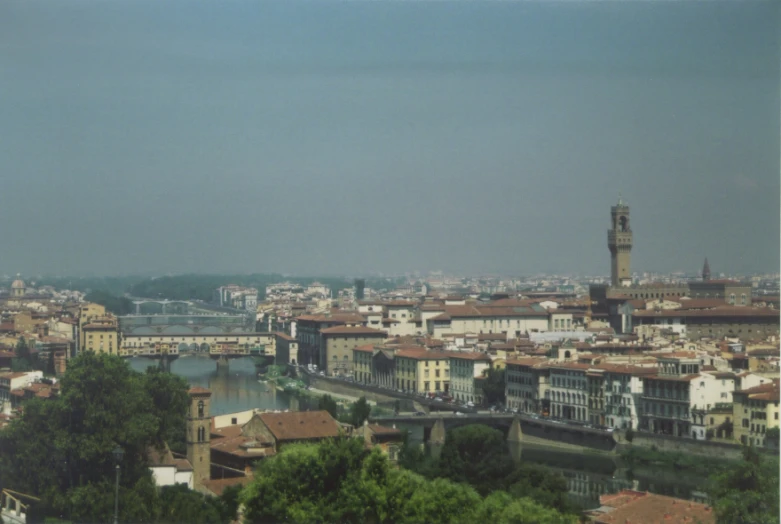 a city with tall buildings and a clock tower