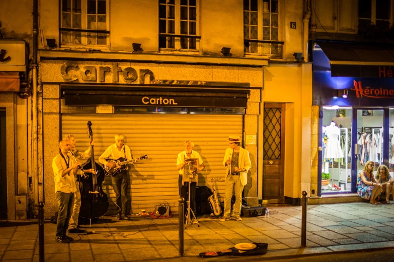 some people are playing on a street corner