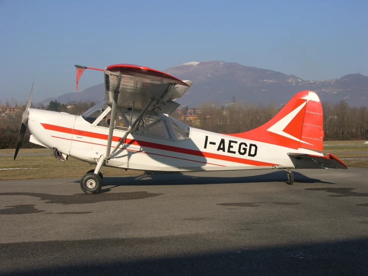 a small airplane sitting on top of an airport runway