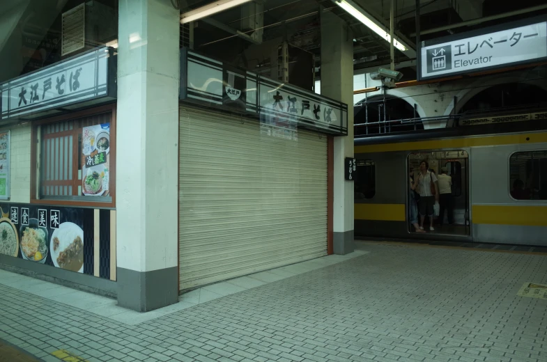 the inside of a train station with two doors