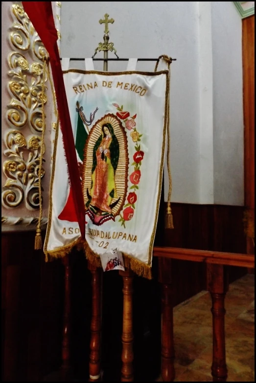 a cross is on the altar next to a cloth