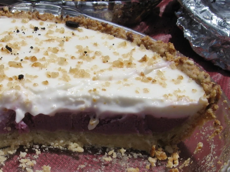 a pie with some crumbs sitting in a pie pan