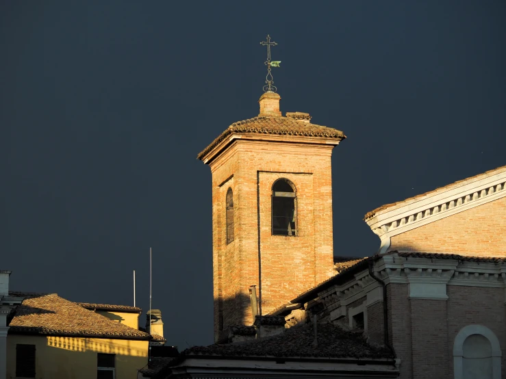 a tower with a clock on a brick building