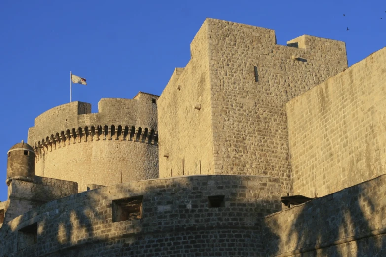 a large castle made of stone with a clock at the top