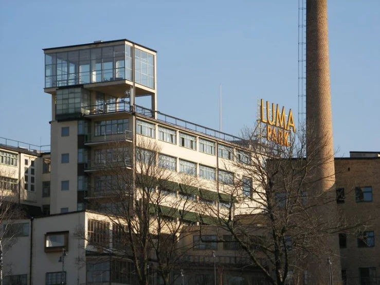 some buildings are shown behind a big tower