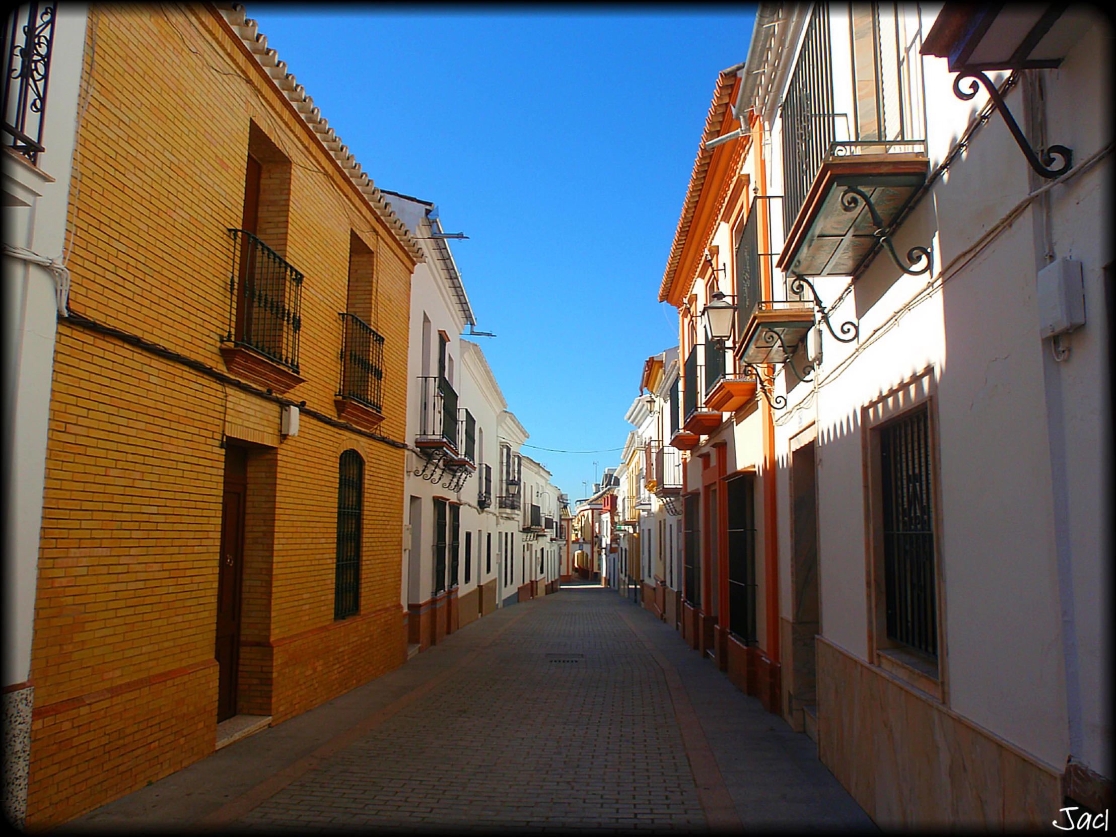 an alley leading to many small building