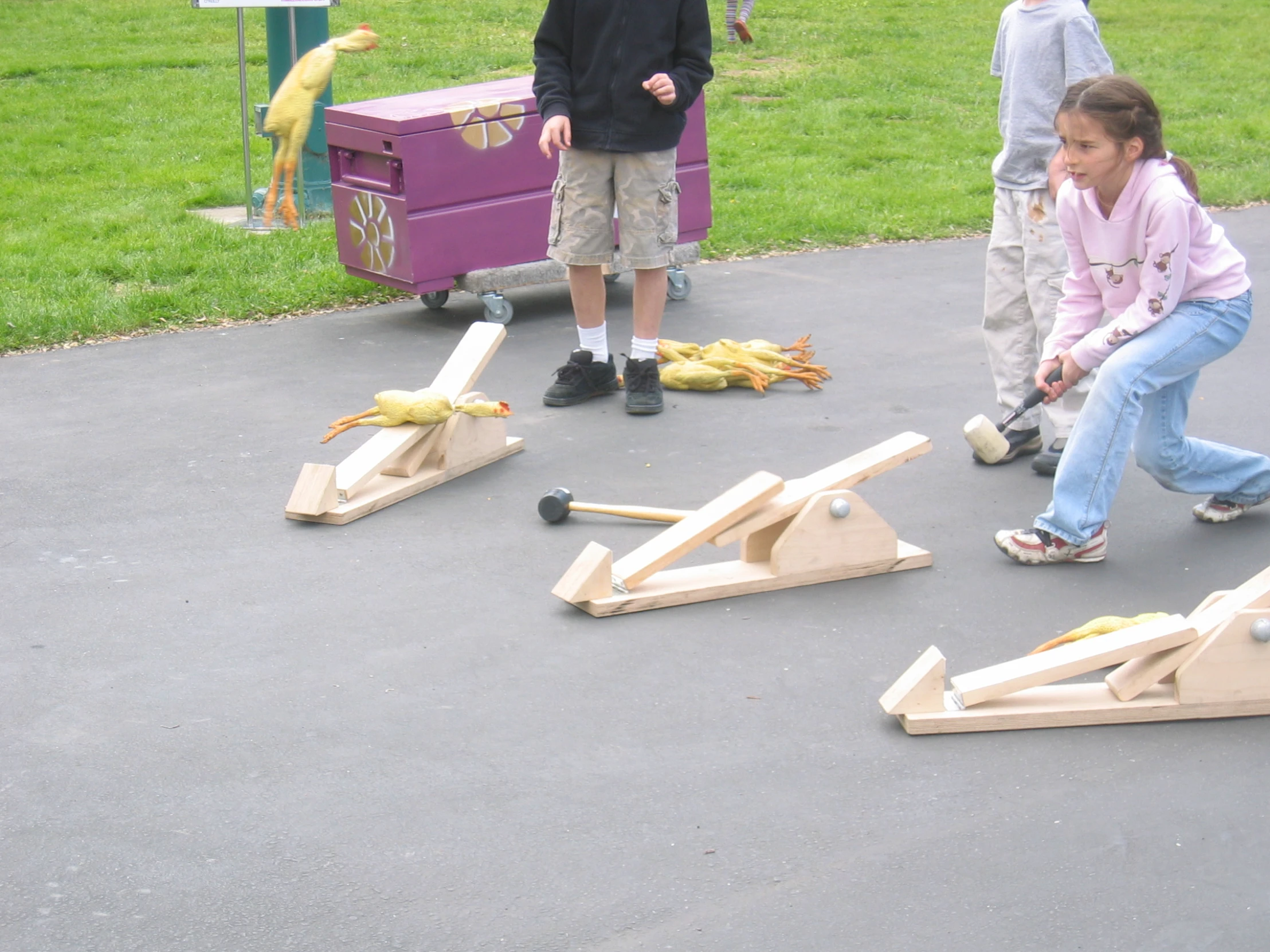 two little girls playing with bananas in a play area