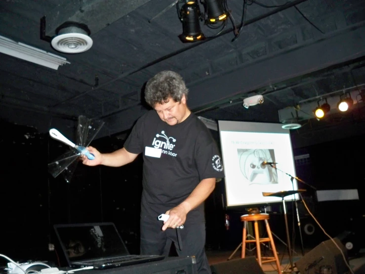 a man using a video game controller in a room