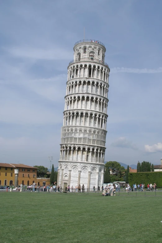 a tall tower with windows in the middle of it