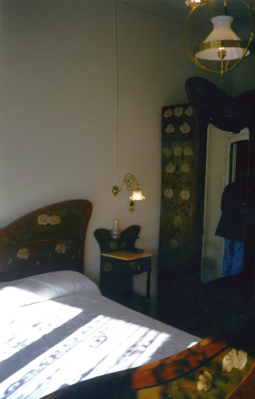 an image of a bedroom setting with a lamp