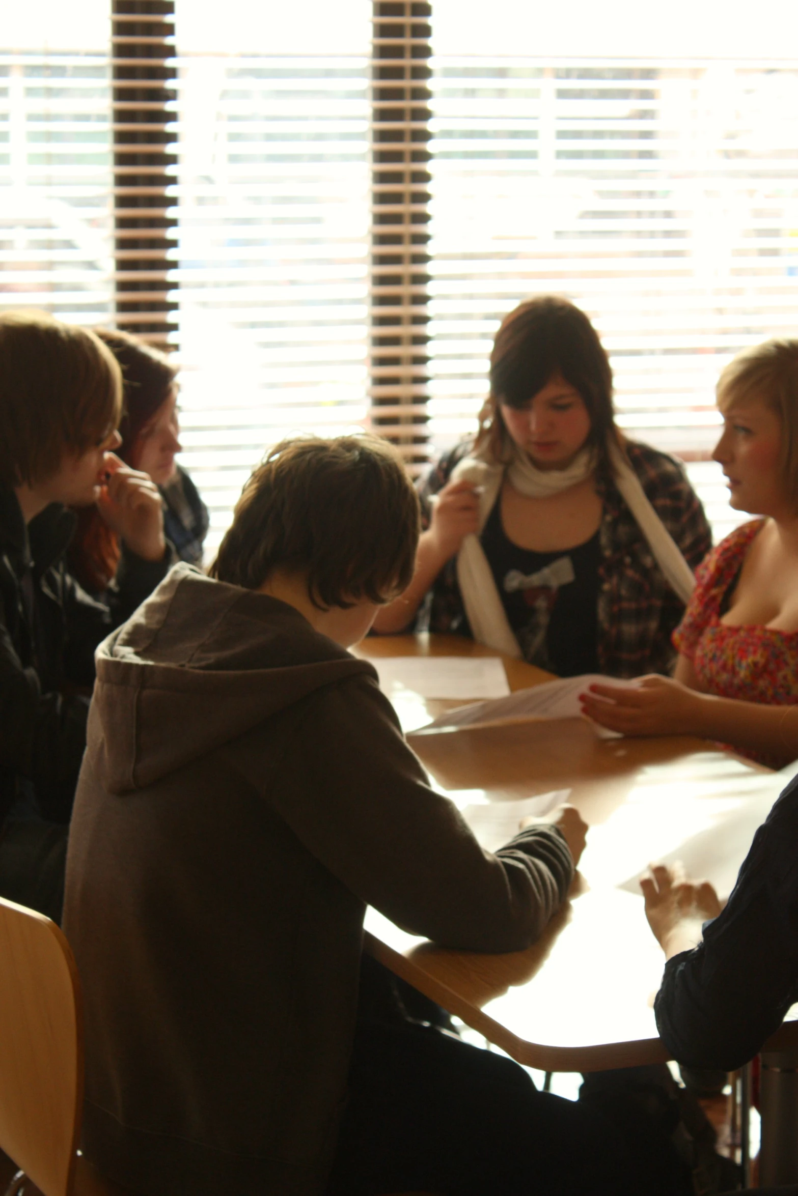 there is one boy at the table signing soing