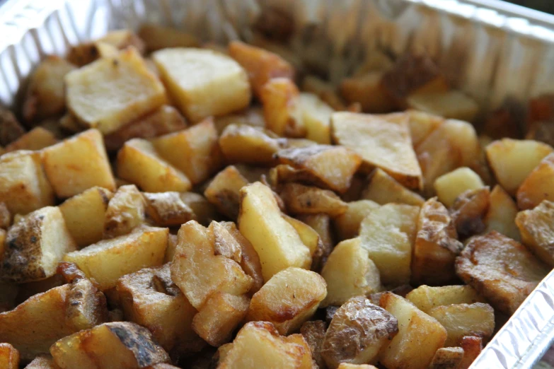 a metal pan filled with some tasty looking food