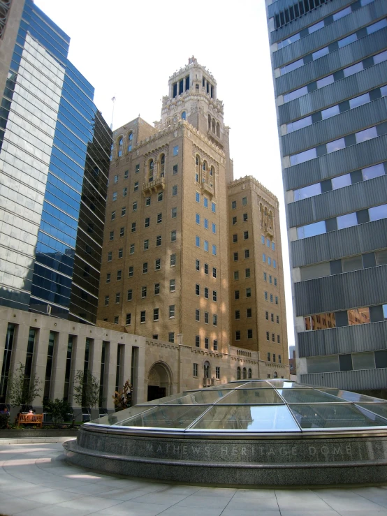 a fountain and buildings in the distance