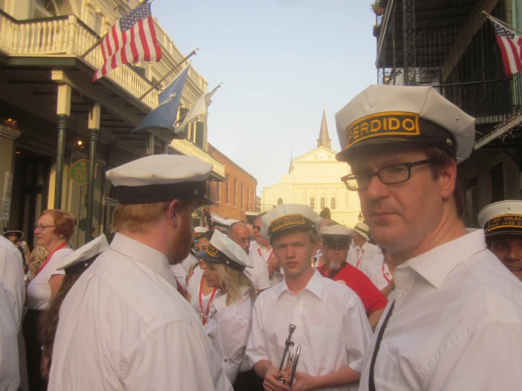 an outdoor parade with men in uniform talking to each other