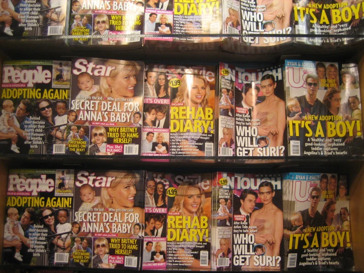 the covers of magazines are stacked on display