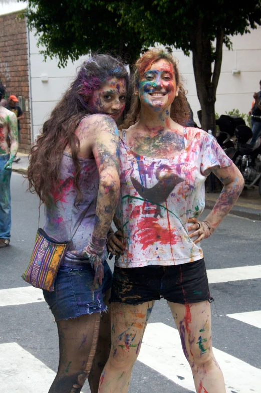 two women dressed up like zombies are standing near each other