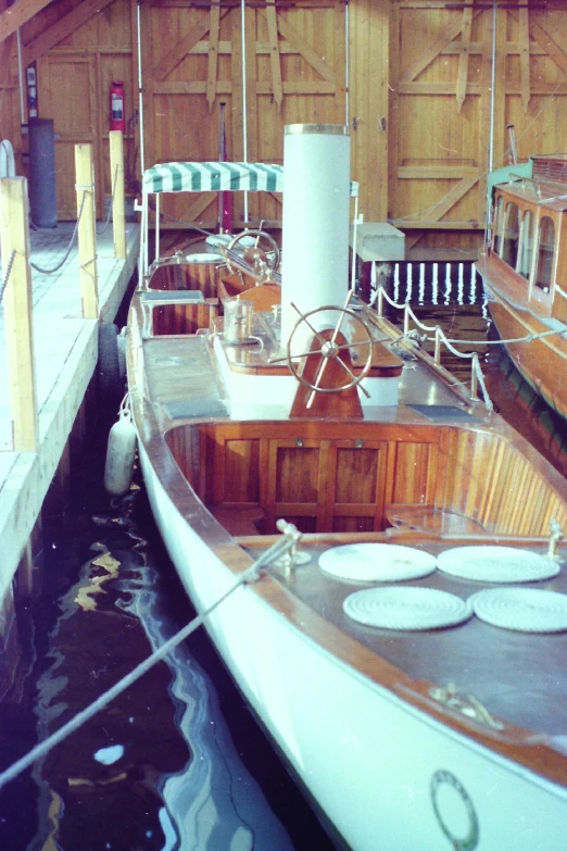 two wooden boats in a wooden dock