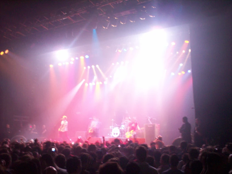 a crowd watching a concert on stage