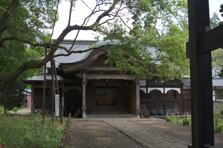 a very cute looking small house under some trees