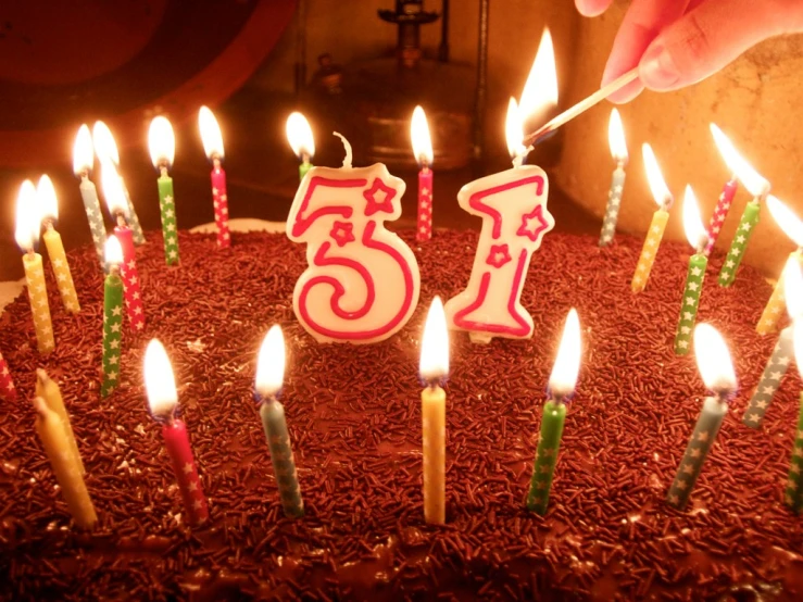 a cake with five birthday candles and six candles