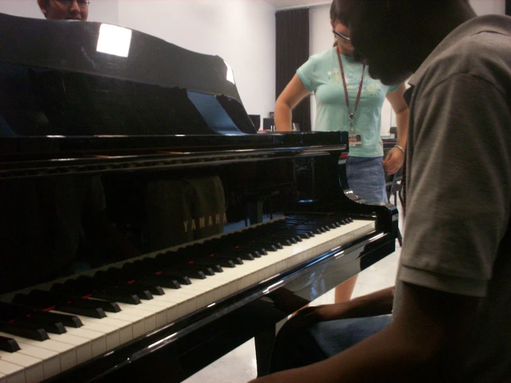 the two musicians are practicing their piano ss