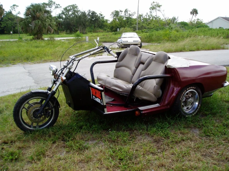 an odd motorcycle sitting on top of grass