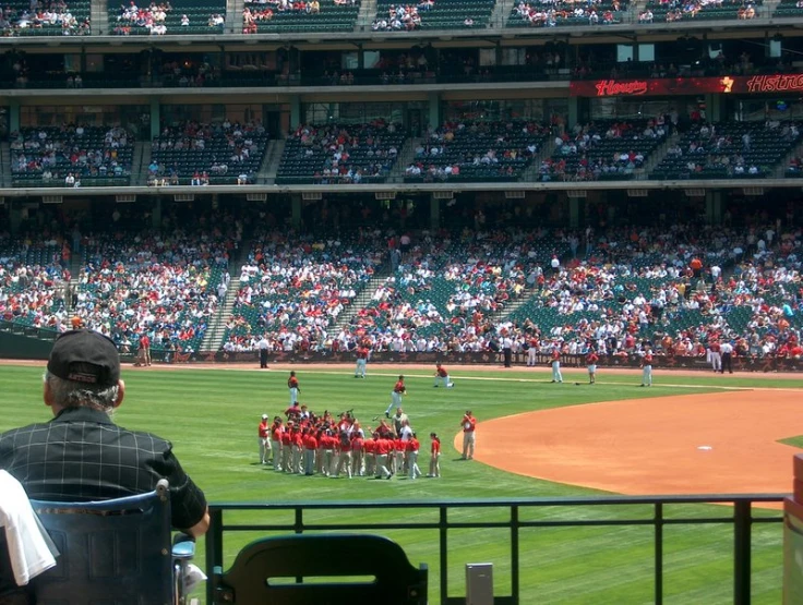 some people are playing baseball at a game