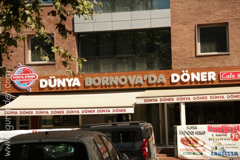 an asian shop with an ad for dunya, boronondada doneer on the side of the building