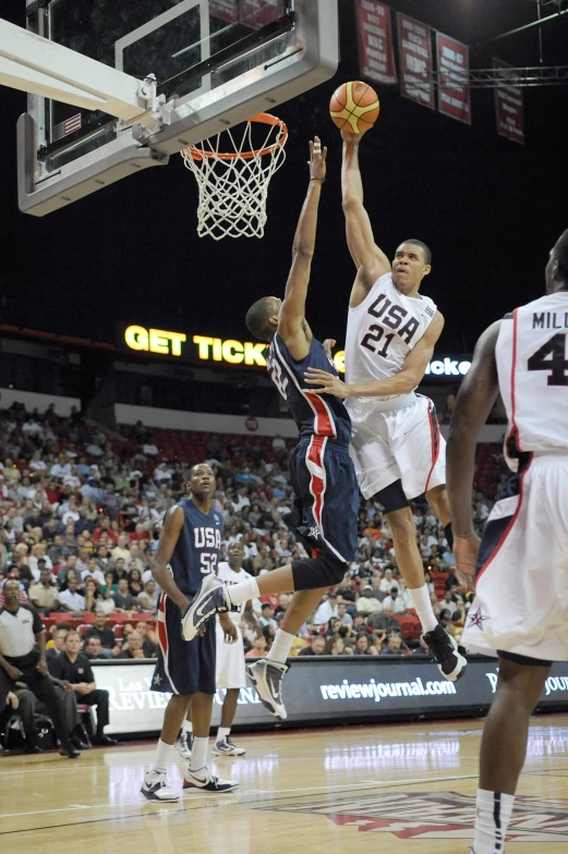 a man that is flying through the air with a ball