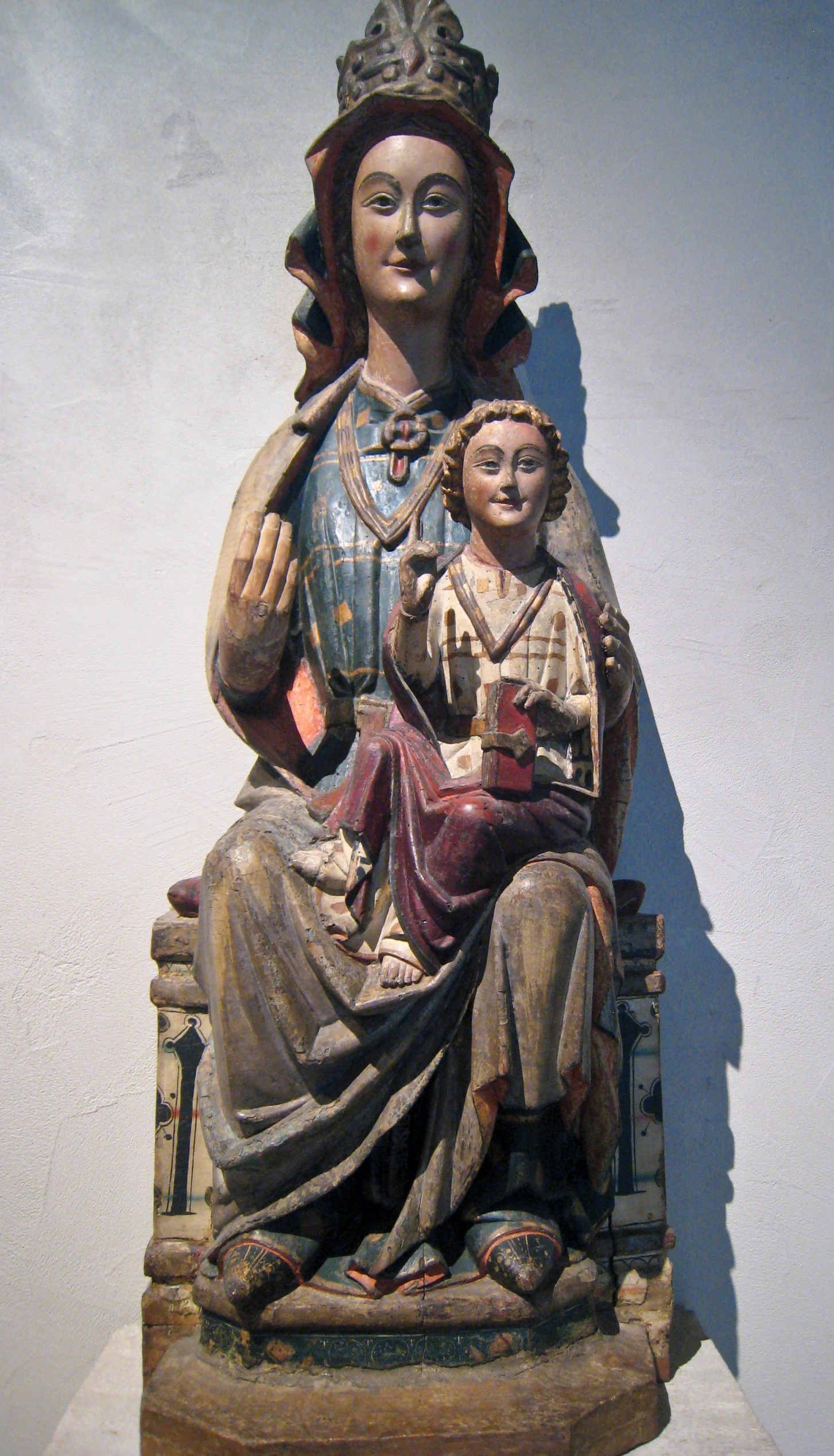 a statue depicting a woman holding a baby