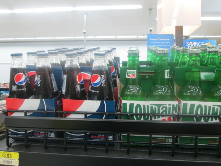 a grocery store aisle filled with lots of soda and soft drinks