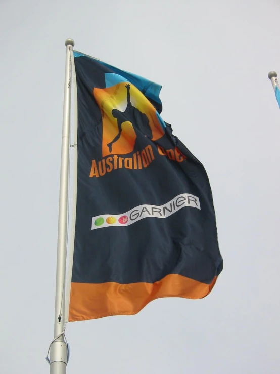 the flag of australia flying in front of a pole