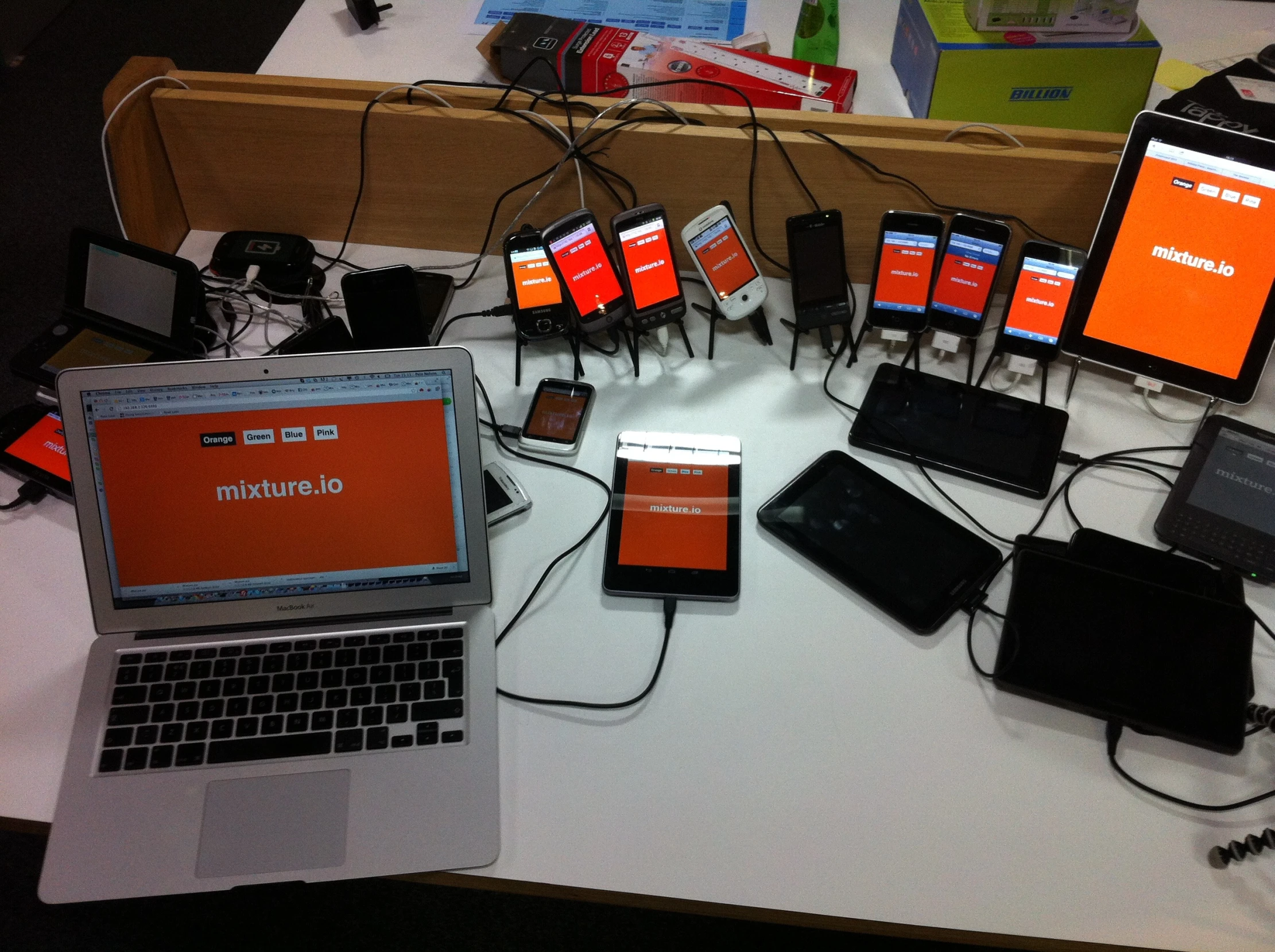 a desk with multiple electronic devices attached to it