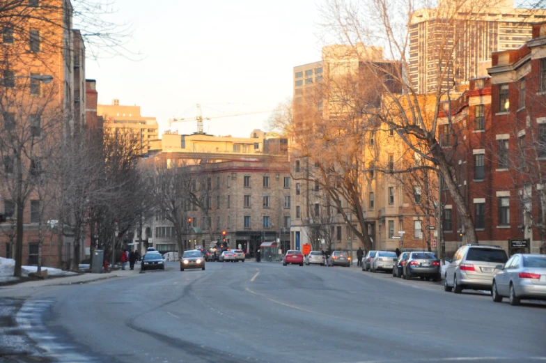 a city street filled with traffic and lots of buildings